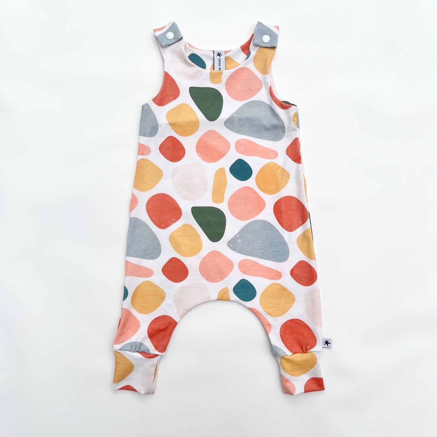 Warm toned abstract print unisex children’s romper