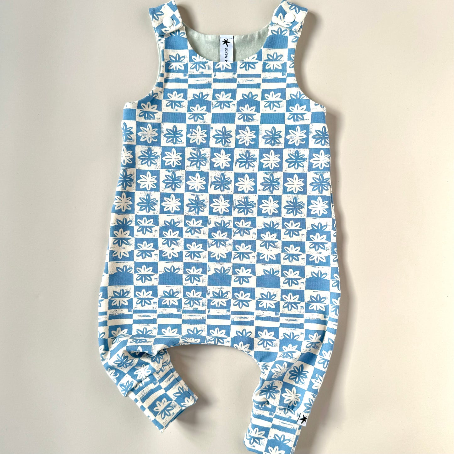 Blue and white check floral print romper for kids organic fabric handmade in the UK Emma Neale Baby romper