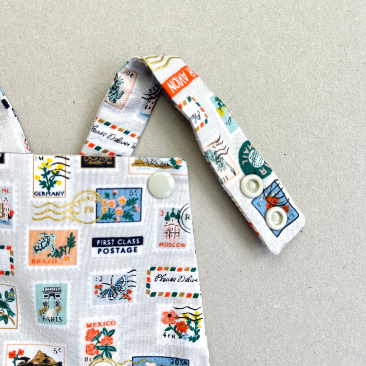 WORLD TRAVELLER SHORT ROMPER in STONE