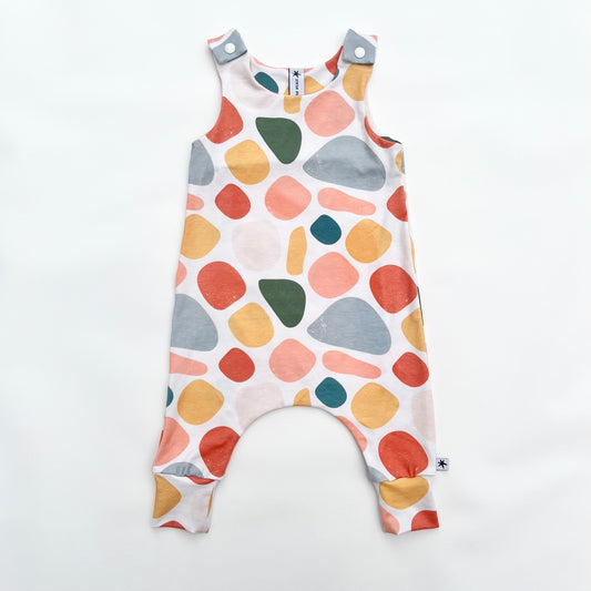 Warm toned abstract print unisex children’s romper
