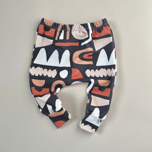 Unisex kids baby leggings in warm neutrals on navy Toybox design organic fabric printed in the UK