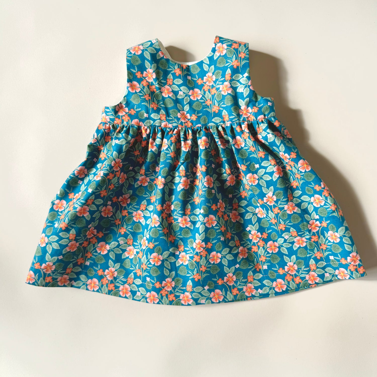 Blue floral sleeveless baby toddler dress in modern floral print cotton baby dress